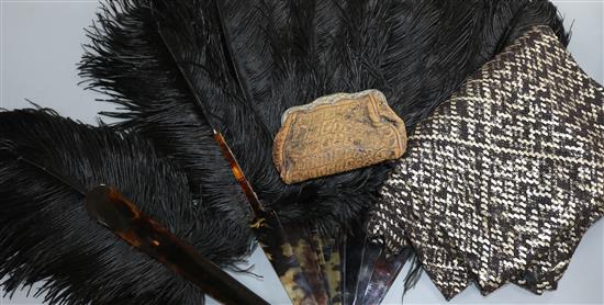 A tortoiseshell black feather fan and an Egyptian metal and black stole and an Edwardian purse